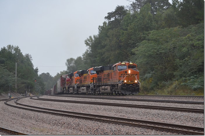 We heard the rumble of a train coming from the north and obviously straining up a heavy grade. NS’s line from Birmingham to Memphis is nearby, but we were not to be disappointed. BNSF 6883-7426-6207-4705 lead this 107-car southbound manifest toward Birmingham. Quinton AL.