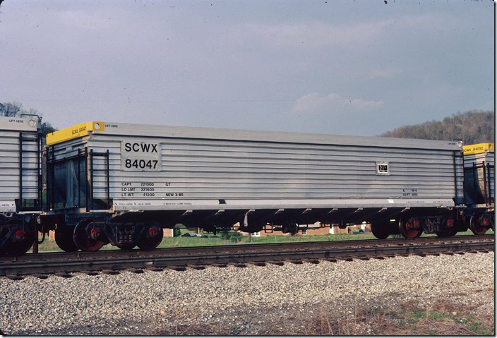 SCWX gon 84047 passing the West End of Pauley near our house on 04-16-1985. At that time we lived across the street from the brick house you see through the brake rigging. A forest has since grown up which would have largely obscured my view of the track had we not built nearby and moved in 1988. Where I’m standing is now a front yard...don’t know how they stand all that blowing for the crossing to my left.