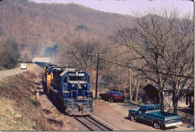 C&O 4826-4284-4182 head up the Long Fork SD at Salisbury (Printer, KY post office) with empties. 02-1981. The spur to the Spurlock Mine crossing the bridge in the background is very active, but the rest of the line to Price has been inactive for years. Dawkins Middle Crk SD.