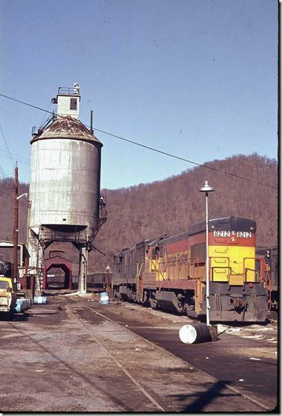 C&O 8212-3306 being serviced at Martin KY engine terminal. 02-1973. Everything except the yard is gone now. E&BV SD Martin.
