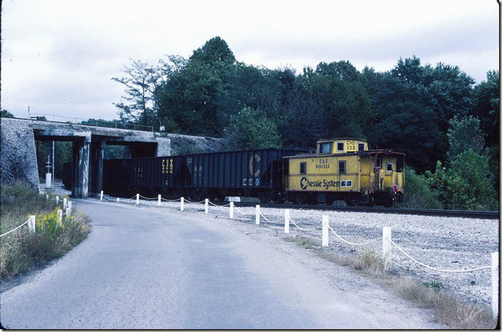 Extra 8087 South passes under the “Hi Line”. SBD was desperate to be borrowing C&O mine run cabooses! 10-03-1987. Corbin KY.