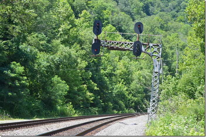 CSX medium clear signal at FO Cabin for a westbound on the No. 1 main to single track. If you think the cantilever signal is leaning slightly it is. A big derailment here in the late 1960s hit it.