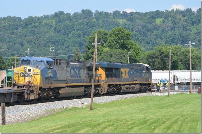 The inbound crew exchange notes with the outbound crew. CSX 911-555. Cumberland MD.