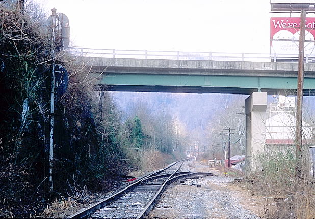 Looking east toward Monitor Jct. That's WV 10 going overhead. The siding once served Logan Concrete.