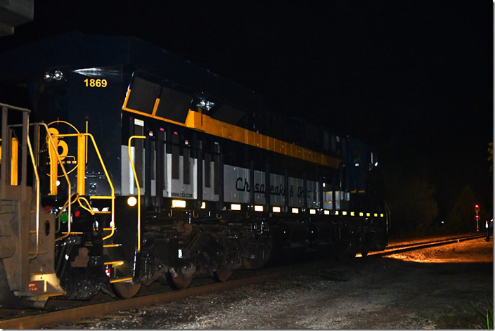 Late in the evening od 09-12-2023, I heard an eastbound call a signal as “1869.” Maybe I better walk down to the track and check this out better. It was the C&O Heritage ES44AH 1869 leading ethanol train B651. I grabbed my keys and camera and headed out the door. I arrived at the east end of Shelby at 11:35 PM. I never realized how dark Shelby was at night! The Russell crew is preparing to cut off, back down to the ready track, and pick up an additional unit. CSX 1869. C&O Heritage. Shelby KY.