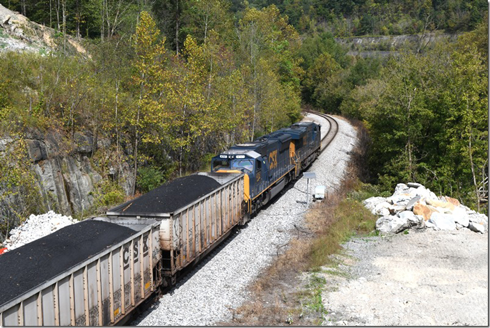 Coal train C210-05 has 110 loads from Mountain Laurel mine at Sharples for the DTA export pier at Newport News. CSX 3075-4767. Beth Mine WV.