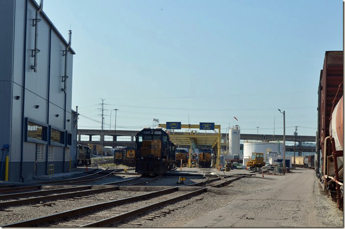 The west side of the shop with SD40-2 8252 with the servicing area in the background. CSX terminal. Queensgate OH.