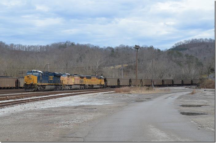 CSX 974 with UP 6443 and 2454 pull empty petroleum coke train K222-31 (Rincon – Chicago UP Proviso) into the yard. Shelby.