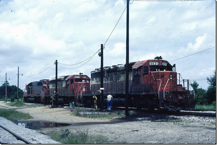 ICG SD40s 6031-6033-6041 cut off from train SE-1 (Chicago to Birmingham) and spotted on the fuel pad at the north end of Fulton Yard on the Cairo District main line. Fulton KY. 08-09-1986.