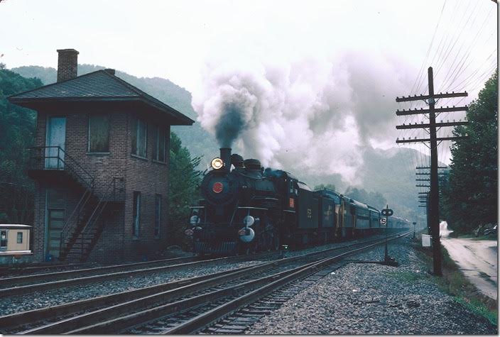 4-6-2 L&N 152 has just left Loyall and passes the tower at Baxter. The Poor Fork Br. to Lynch diverges in the foreground.