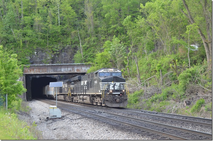 In West Williamson empty e/b coal train 831-06 exits Mingo Tunnel WV behind NS 8162-4074 with 2 loads and 90 empties.