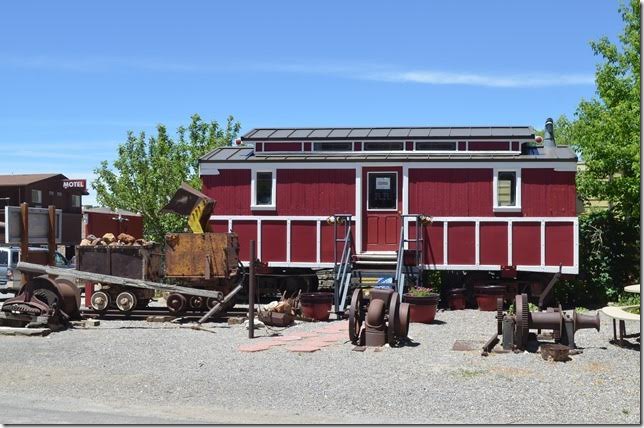 Surrounded by various mining implements, this “crew car” is the only item of the abandoned Eureka & Palisade Railroad that survives. It is now an economic development office. The E&P was abandoned in the mid-1930s.