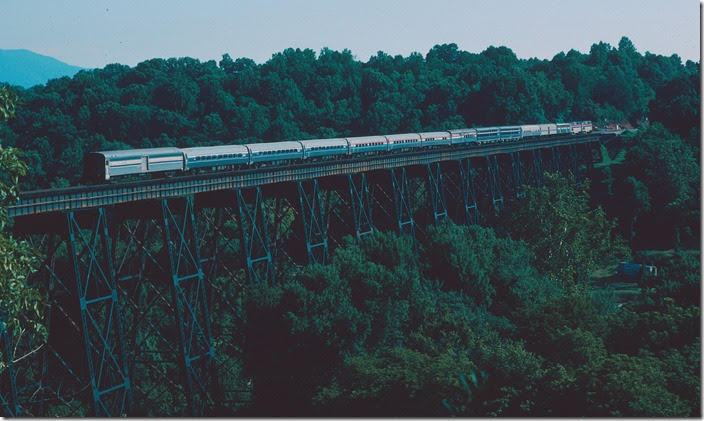 Amtrak No. 20, the Crescent, heads north on 07-11-1998 with 13 cars at 9:20 AM. Southern Ry. Lynchburg VA.