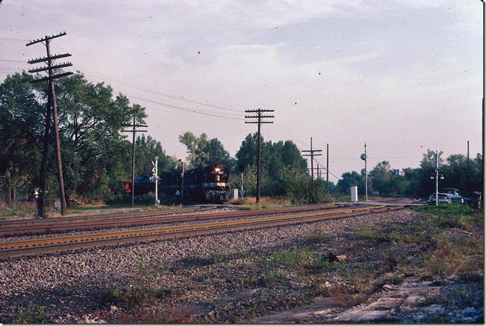 Westbound local #72 approaches the BN (former CB&Q) crossing at Centralia IL. 09-25-1981.