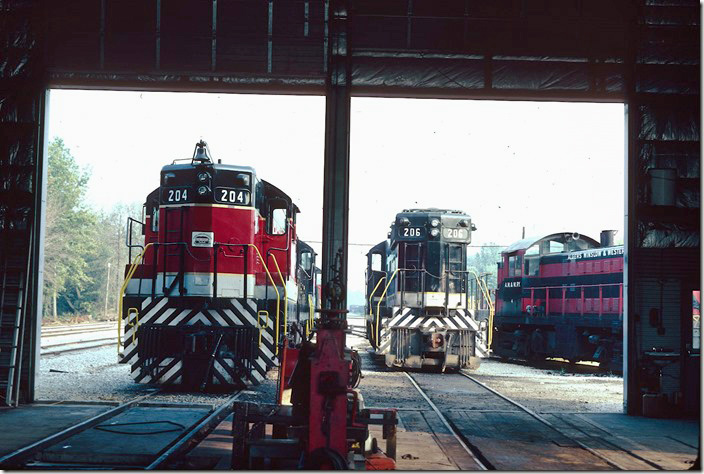 Ex-Southern (nee-Central of Ga.) SD9s at the Oakland City IN engine house have replaced the venerable ALCo RS-1s. Nos. 205 and 206 are now on the Indiana Eastern at Cottage Grove IN working over the former C&O and still in AW&W paint! 09-03-1981.