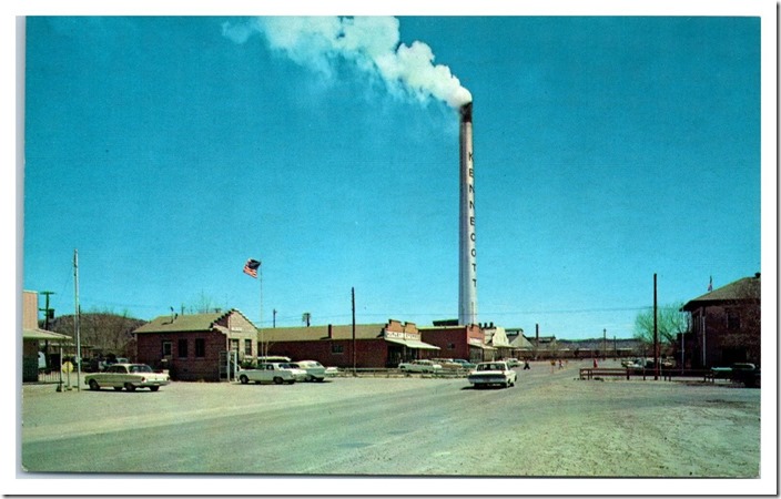 The smelter is gone, but the Hurley post office is still an active location. KCC smoke stack. 1960s. Hurley NM.