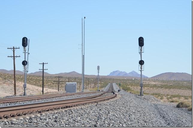 Looking west on the Union Pacific at Garnet NV. We were 23 miles north of Las Vegas and exiting I-15 east onto US 93 north. Hark! There are control point signals over there with easy access. Thursday, June 16th 2016.