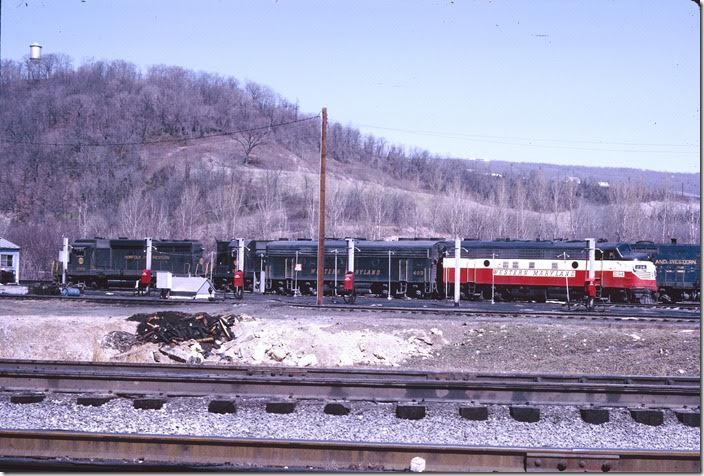 F7a 234 and F7b 403 are on the service track with a lash-up of N&W power. N&W GP30 2906 is ex-NKP. WM Ridgeley WV.