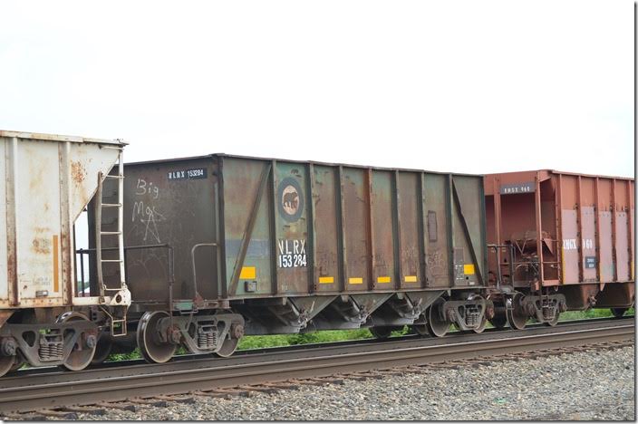 NLRX is the reporting mark for National Lime & Stone. Maybe ex-Algoma Central? On CSX K934-17 heading from Fostoria to Carey. 06-18-2015. Ex-HKGX (Haines & Kibblehouse, Inc.), same numbers. They originated in AC series 8330-8500; some came via the SSAM or WC 208330-208500 series. National Steel Car was the builder, during 1974 and 1975. NLRX hopper 153284. Fostoria.