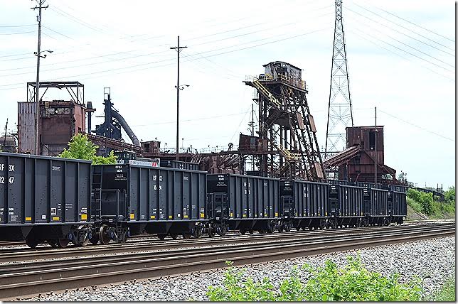 Looks like a switcher is shoving these cars up to the dumper. They could be carrying coke, taconite or limestone. Ashland KY 06-17-2015. RFBX hopper 1624 Ashland KY.