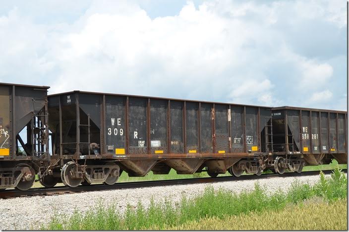 May have been ex-Burlington Northern. WE 309R and 394 were renumbered from WE 548926 and 548932, respectively. WE series 548850-548999 were ex-BN same, and although I feel like I should be finding something prior to BN, I can’t. WE hopper 309R Carey OH.