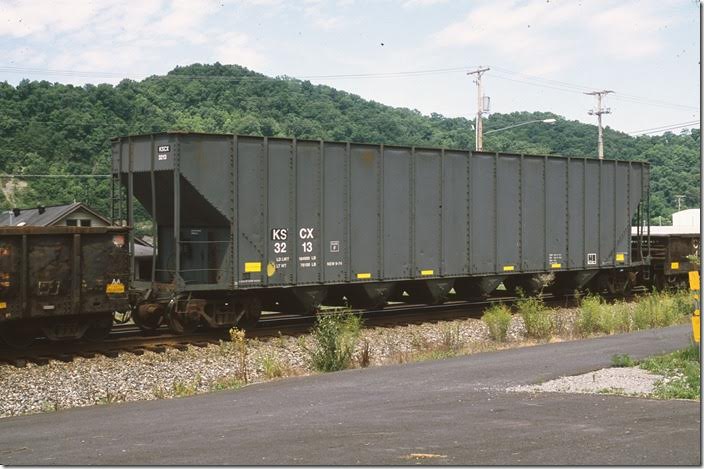 Kapstone Charleston Craft LLC wood chip hopper 3213 on w/b Q697 at Pauley KY on 06-24-2012. Load limit 184,900 and built 09-1974.