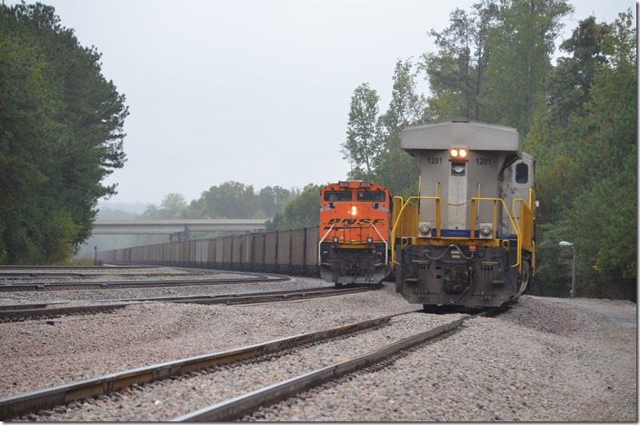 BNSF 9222 is on a northbound empty train, and CREX 1201 is part of a DPU set on a southbound train at the north end of Quinton Yard.