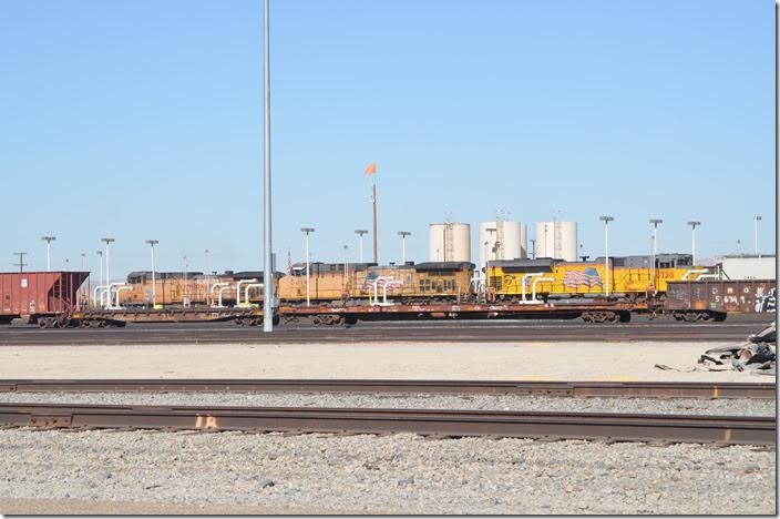 5616-4720 are on the fuel pad (perhaps the other end of the 8493’s train). On the far track is 6511 which will soon depart with a w/b coal train. UP 6511 5616-4720. Yermo CA.