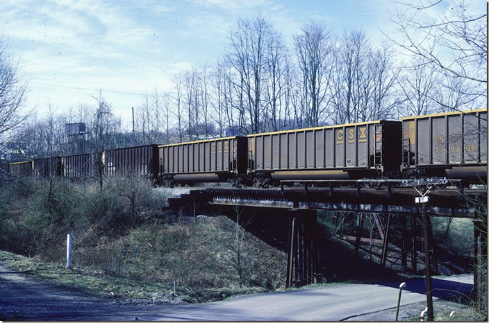 CSX aluminum tubs 379796 and 379711 on coal train T104 (Consol 95 – Bostwick FL). This shot and Google reveals another railroad bridge behind this bridge. Prior to Consol 95 a mine named Katherine (1957) was located on the Robinson Run Branch 0.9 mi from the junction with the MR. Perhaps No. 95 required the original line to be relocated for the loop track. Consol 95.