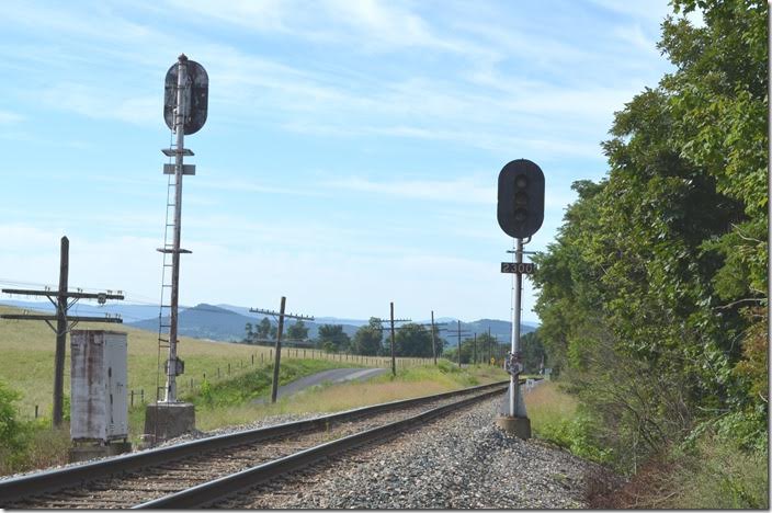 Block signals looking east at Christian. Buckingham Branch eb signal. Christian.