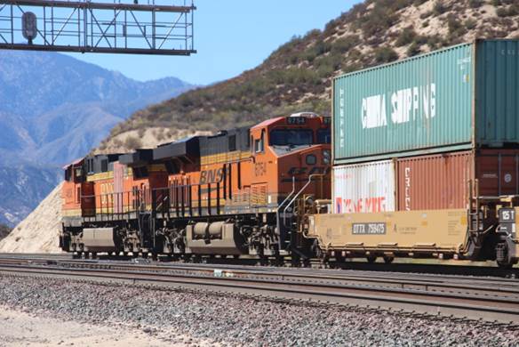 BN-SF 6754, a GE ES44C4, and BN-SF 4608, a GE C44-9W, are providing pusher service to the eastbound stack train seen in the preceding photograph.