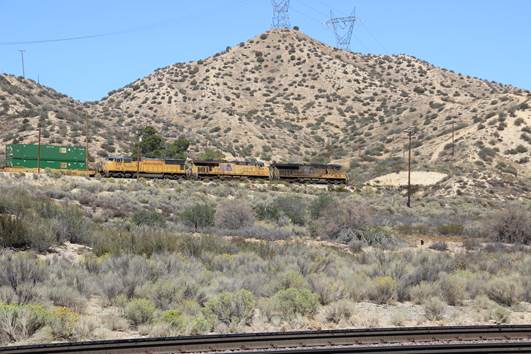 UP 4315, a GM SD70M; UP 7609, a GE C45ACCTE; and UP 5435, a GE C45ACCTE, are east bound with a stack train on the UP mainline.