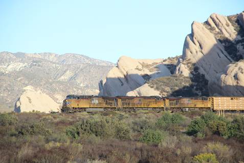 UP 5387, a GE C44ACCTE; UP 8072, a GM SD90/43AC; and UP 5425, a GE C45ACCTE, lead a manifest train west at CP SP468.5.