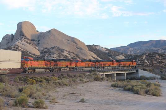 BN-SF 6823, a GE ES44C4; BN-SF 8016, a GE ES44C4; BN-SF 8070, a GE ES44C4; BN-SF 5466, a GE C44-9W; and BN-SF 7654, a GE ES44DC, are eastbound at Mormon Rocks.