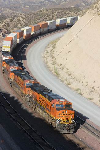 BN-SF 7023, a GE ES44C4; BN-SF 7356, a GE ES44DC, BN-SF 7439, a GE ES44DC; and BN-SF 6695, a GE ES44C4, are four car lengths short of topping the west side of Cajon Pass.
