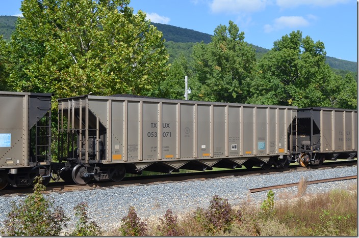 TXUX (Luminant TU Electric) hopper 053071 in KCS s/b freight at Howard AK. 09-25-2015.