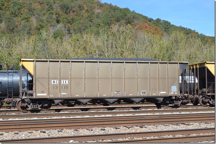 MCEX (Midwest Car Corp.) hopper 13185 was built by Trinity 06-1994. Load limit is 233,700 lbs, 4,000 cu. ft. Ex-JTMX, nee JRTX. Shelby KY. 10-19-2014.