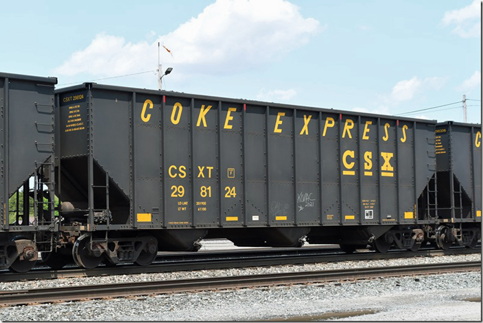 CSX coke hopper 298124 on w/b B157-19 at Willard OH, coke express bound for a steel mill in northern Indiana along the lake. This car has a load limit of 201,900, a volume of 5,300 cu ft and was built by Freight Car America at Roanoke in 06-1997. It is slightly smaller than the NS “High Top.” 05-21-2023.