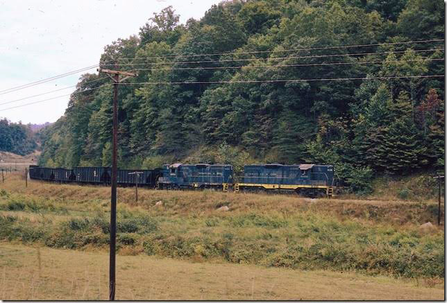 C&O 6196 heads east near Prestonsburg KY, on the Middle Creek SD with empties for the mine at David. 10-1971. This line has been dormant for years. You can’t take this photo even if there was a train because of a huge stand of pine trees. I think Middle Creek may soon be abandoned and re-purposed as another rail trail. Dawkins Middle Crk SD.