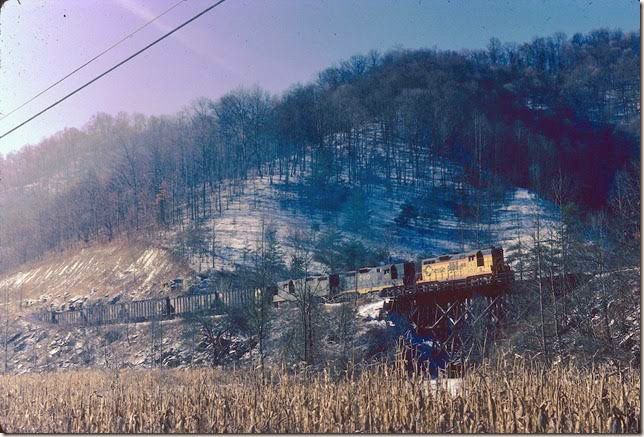 C&O 6031 climbing Deane Mountain toward Beaver Gap with loads from Bethlehem #22. 12-1976. E&BV SD Martin.