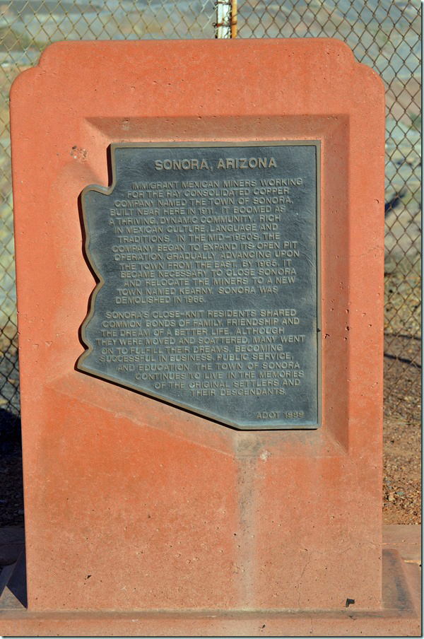 At the Ray mine overlook, this plaque commemorates the former town of Sonora that was consumed as the giant copper mine pit expanded. Sonora historic marker Ray mine AZ.