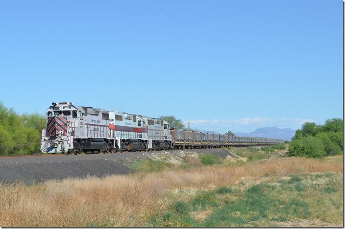 Sue was very tired, so we checked into a motel in Kearney. The OT-1 westbound ore train was called for 4:20 PM and the “acid” or “unit” train for 5:40 PM. Here it rolls west through Kearney behind 502-401-301. There is now only OT-1 daily, but it operates in each direction, with different crews and several times. I think they make 3-4 round trips – approx. 16 miles each way – from Ray Mine to the Hayden dumper. Several years ago CBRY operated an OT-2. CBRY 502-401-301. Kearny AZ.