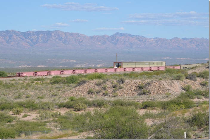 From Hayden we headed south toward Tucson. At San Manuel we paused to photograph the San Manual Arizona Railroad (SMARRCO) trans-load facility. From here they loaded copper concentrate from the mine near Miami AZ. But after reading some of the websites including owner Capstone Mining, rail transportation to a port in Mexico has been replaced with a truck haul. Being a mine property there was a guard house leading down the hill to this facility. SMARR had several GP38s. The locomotives are probably parked in the covered trans-load building shown here. However we saw a couple of large trestles from AZ 77 near Mammoth. The the rails looked shiny and in good condition. I couldn’t determine the reporting marks on these hoppers. San Manuel Arizona RR transload San Manuel AZ.