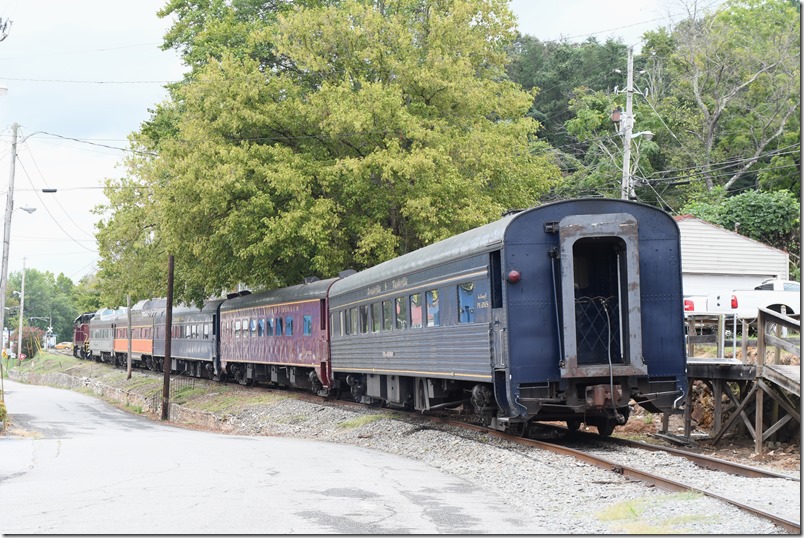 The engine ran around the train at the yard and shoved it up to the unloading ramp downtown. We arrived about 12:45 PM. It was announced that the train would depart at 3:00 PM. Everyone headed a couple of blocks to the restaurants and shops in Copperhill. TVR Copperhill Special.