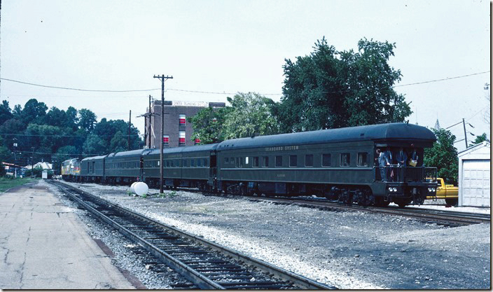 New Seaboard president Richard Sanborn stands on the rear of business car “Alabama.” CSX chairman Hayes Watkins is inside. Sanborn’s tenure will be cut short by a fatal heart attack. His daughter Cindy is now chief of operations with Norfolk Southern. 08-30-1983. SBD Corbin insp train. View 3.