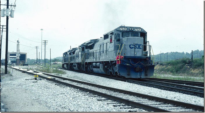 Practically brand new CSX C40-8s 7520-7522-7521 leave the service building for the south end of the yard. 09-17-1989. CSX Corbin KY.