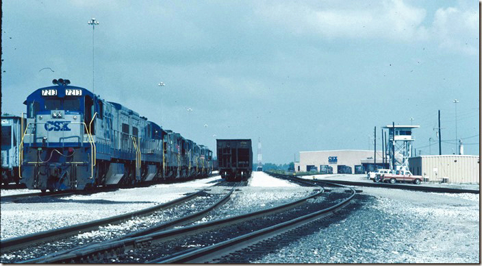 CSX 7213 et al are parked at the south end of an empty track in the west yard. Note the yardmaster’s tower. CSX Corbin KY.