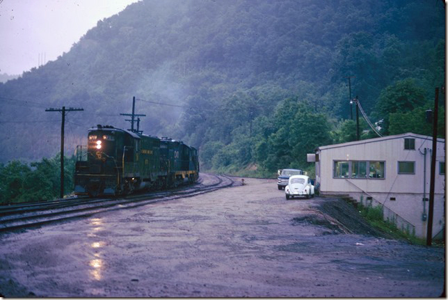 C&O 5711 and a pair of GP9s idle as the crew of this Elkhorn Shifter confer in the CRR yard office. C&O ran one and sometimes two Elkhorn Shifters depending on the loads available to interchange. 06-01-1974.