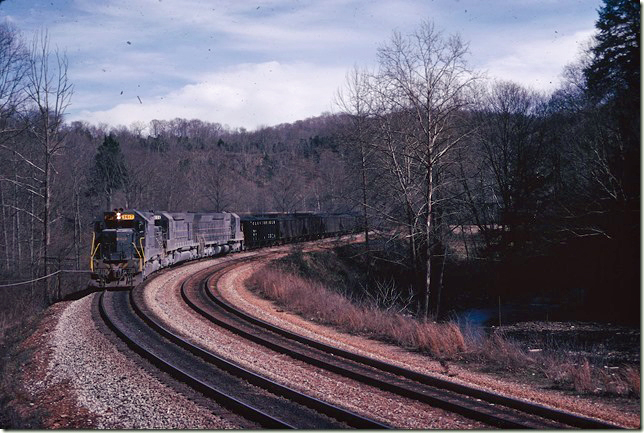 SD45-2 3617-2006-2010 have 140 loads s/b near the north end of Boody passing siding. 03-06-1976.