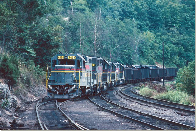 GP11 4604-6000-4605-6003-6001 switch cars at Boody interchange yard with a N&W crew present. A lot of Clinchfield Coal Co. (Pittston) coal went to the N&W for export through Boody. 08-25-1979. No interchange occurs at Boody now.